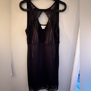 Black slip with lace detail. Adjustable straps. Keyhole neck.